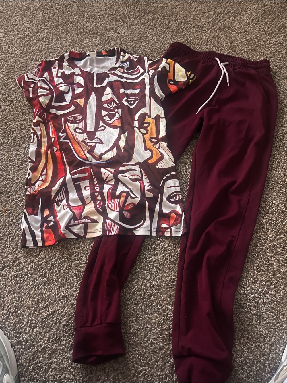 Women’s 2 piece burgundy jogger and face printed top size M/L